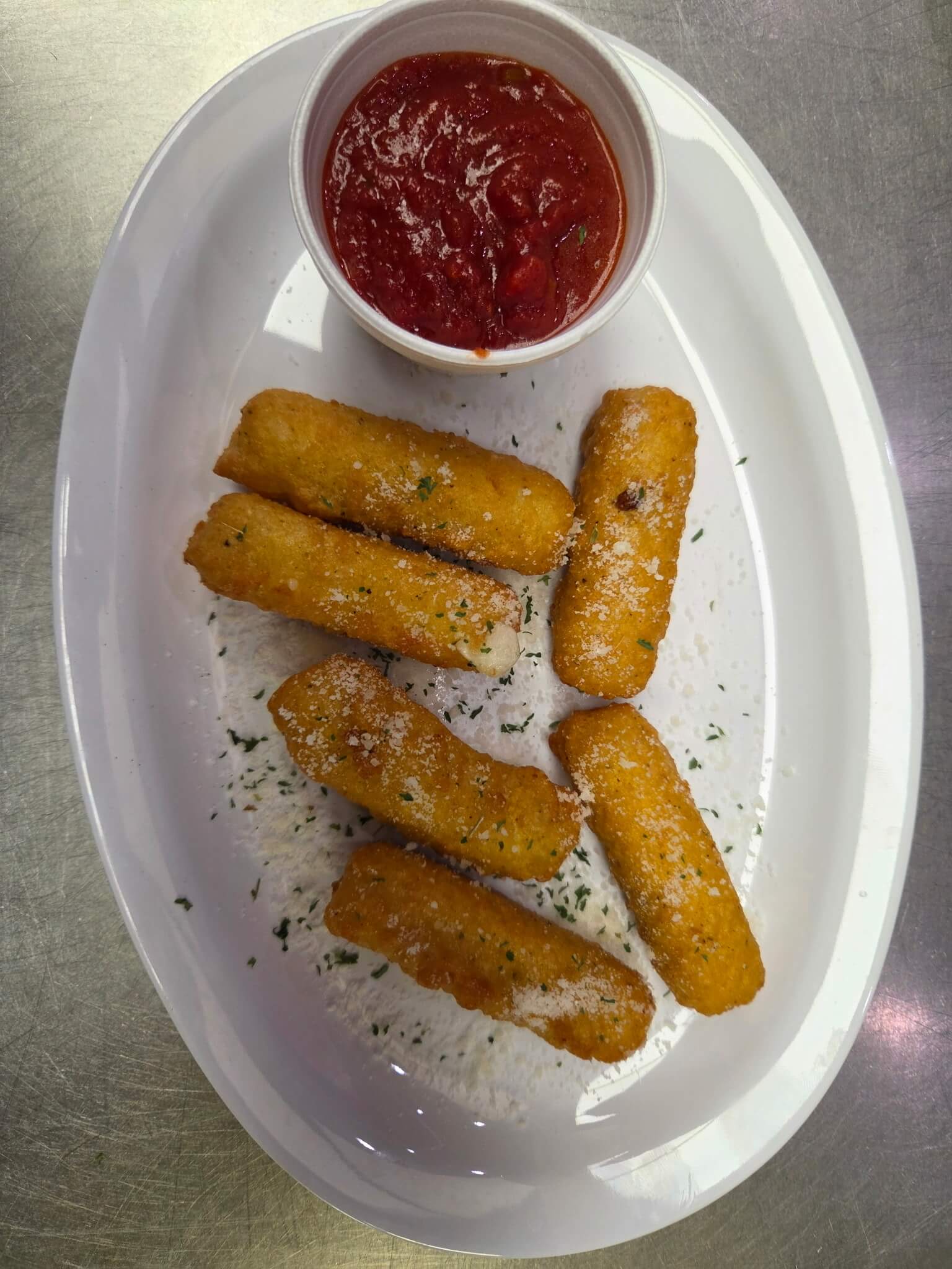 Mozzarella sticks and marinara sauce at Bambino's Pizza in Morrisville, NC